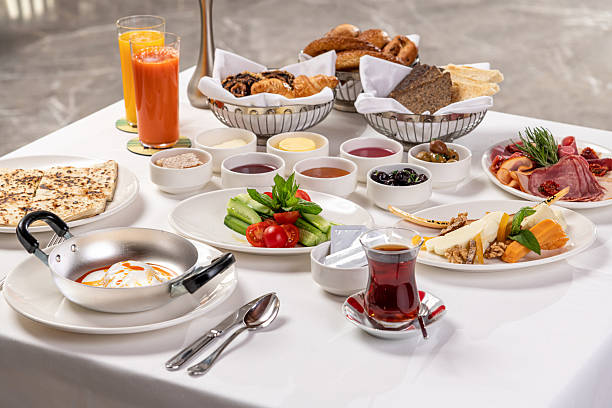 Shared meal with varied dishes on a dining table